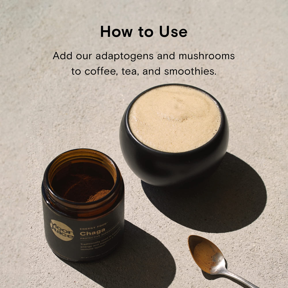 Moon Juice Reishi powder being stirred into a hot beverage for easy use.