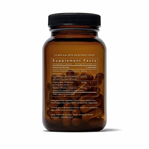 Moon Juice SuperYou bottle on wooden surface evokes daily self-care ritual.