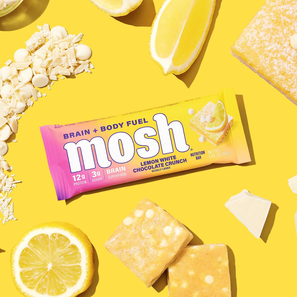 Glass of water beside MOSH Lemon White Chocolate bar, ready-to-go snack.