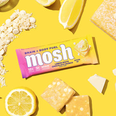 Glass of water beside MOSH Lemon White Chocolate bar, ready-to-go snack.