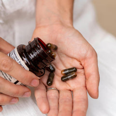 Motherlove More Milk Moringa herbs blend in a rustic bowl representing organic ingredients.