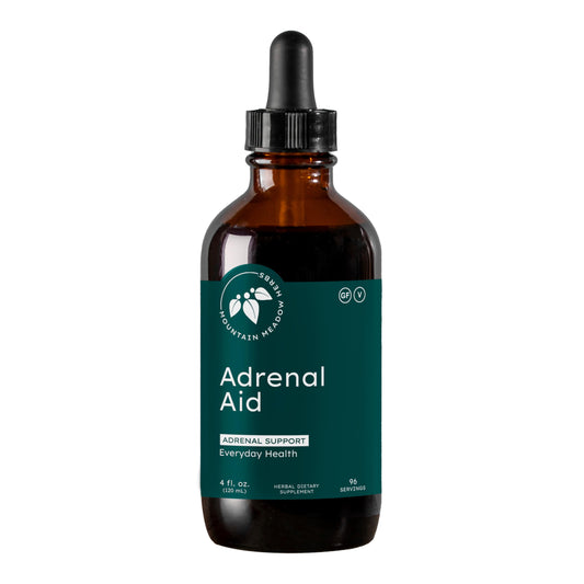 Mountain Meadow Adrenal Aid bottle on a clean surface, suggesting daily support and calm.