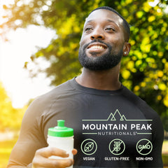 Glass of prepared Mountain Peak orange energy drink for steady focus