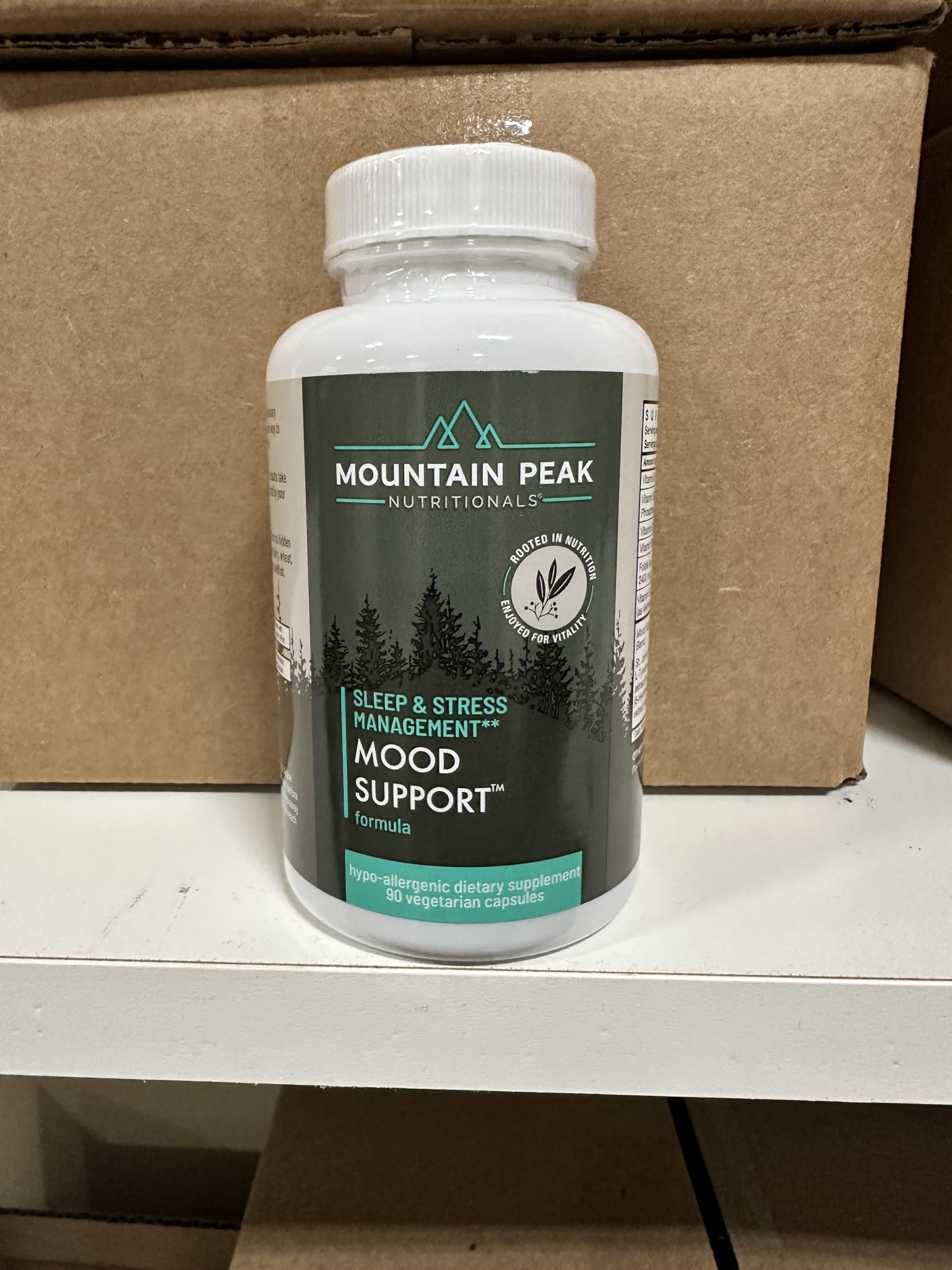 Mountain Peak Mood Support jar with capsules demonstrates allergen-friendly, vegetarian capsules.