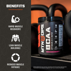 MTN OPS BCAA powder bottle with glass to illustrate easy mixing and flavor.