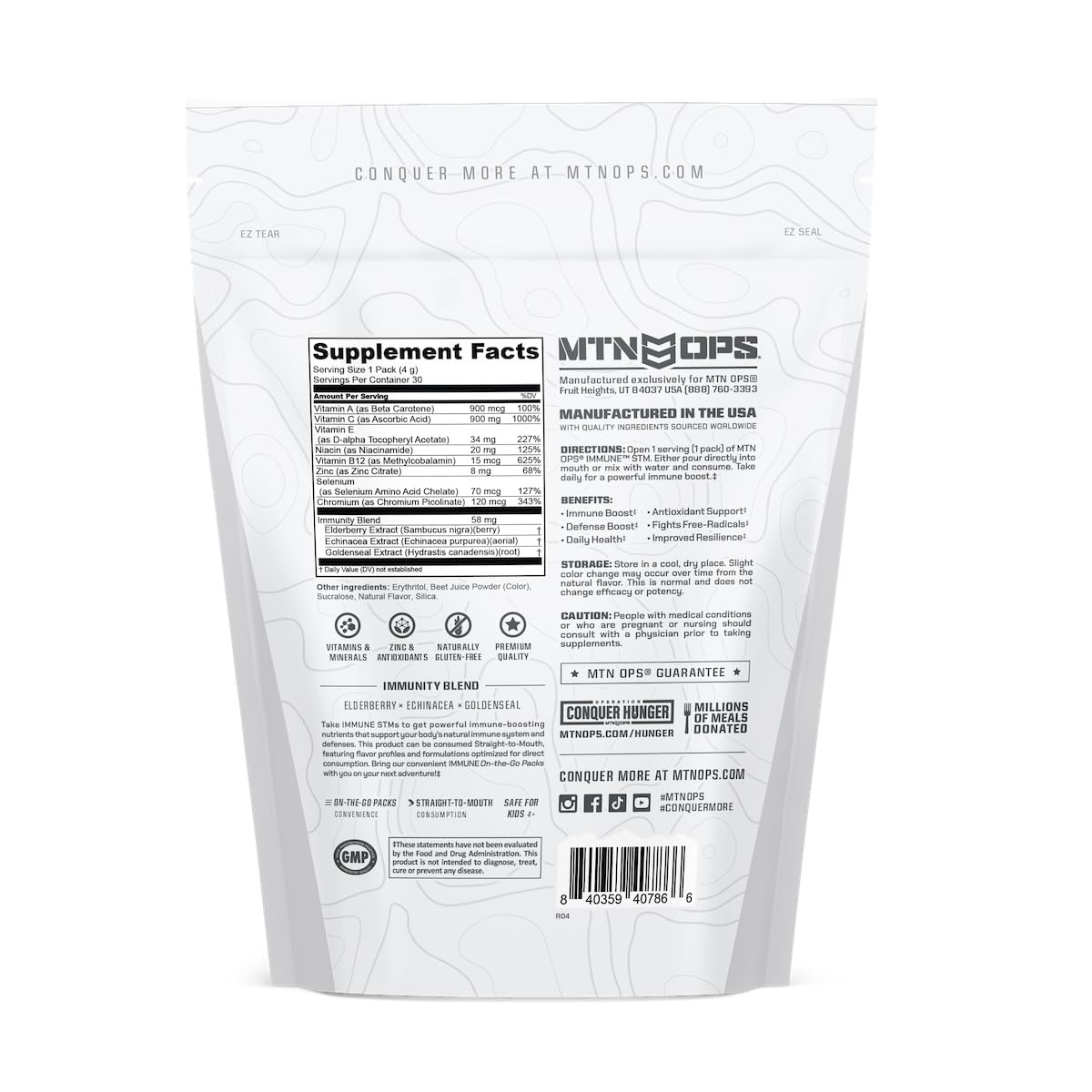 MTN OPS Immune STM raspberry flavor scoop resting over powder.