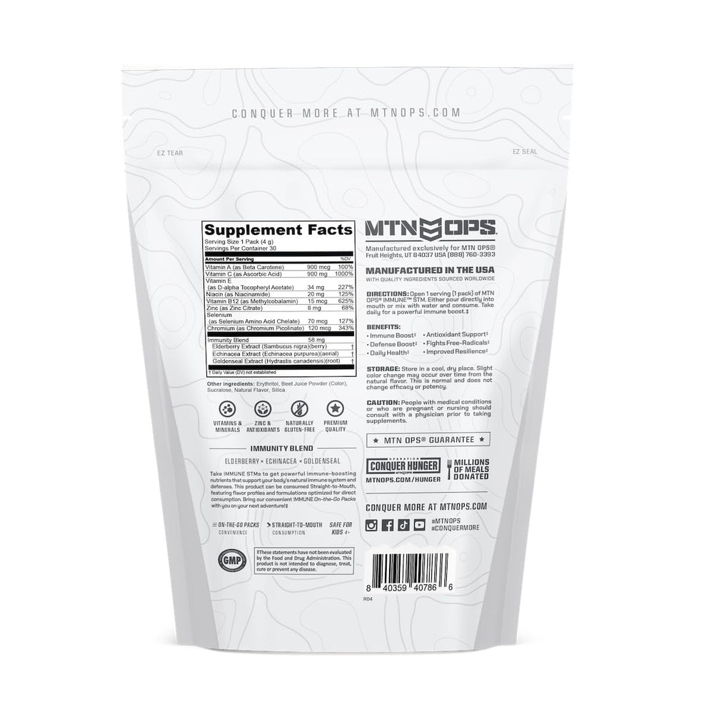 MTN OPS Immune STM raspberry flavor scoop resting over powder.