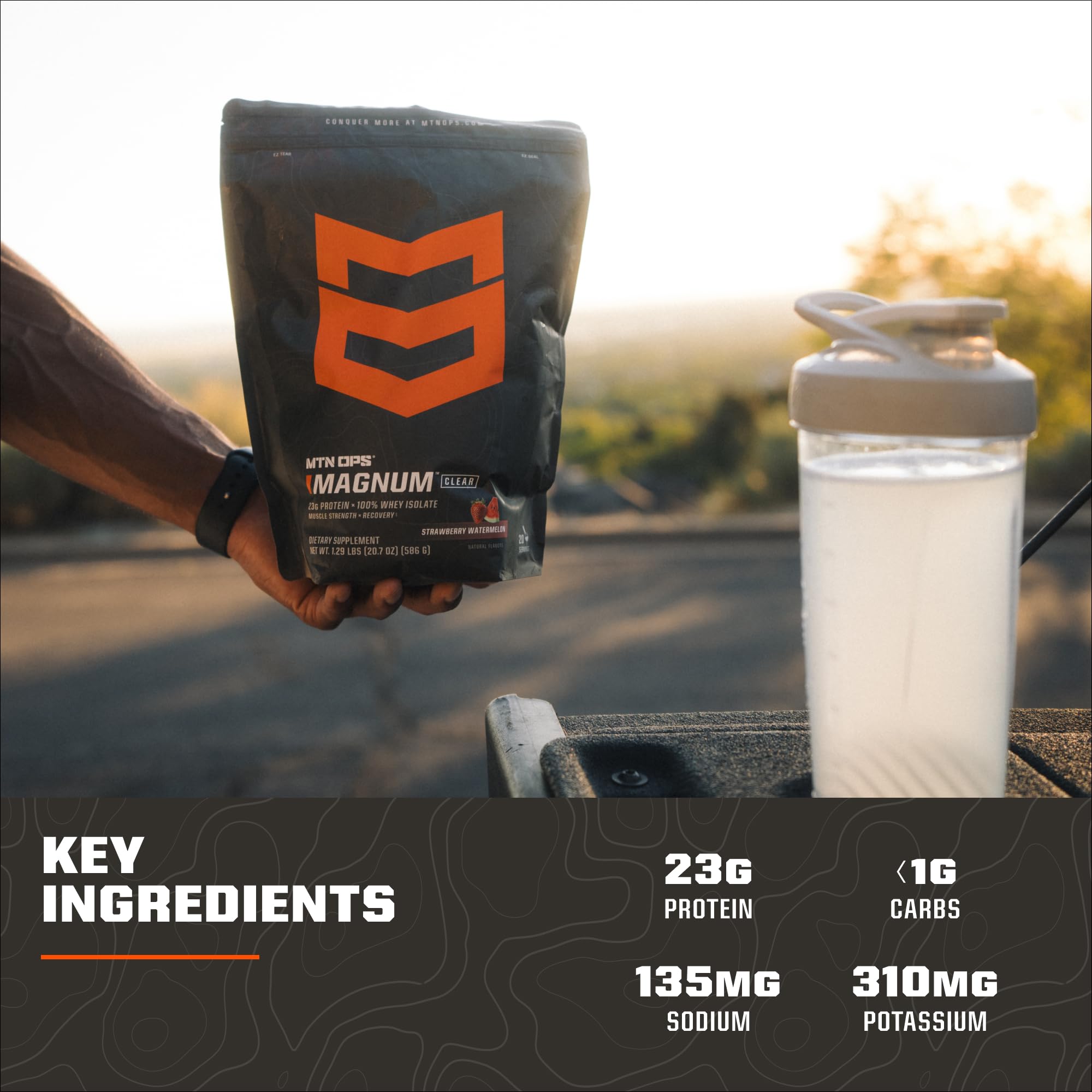 Close-up of Magnum Clear Whey powder scoop beside the tub.