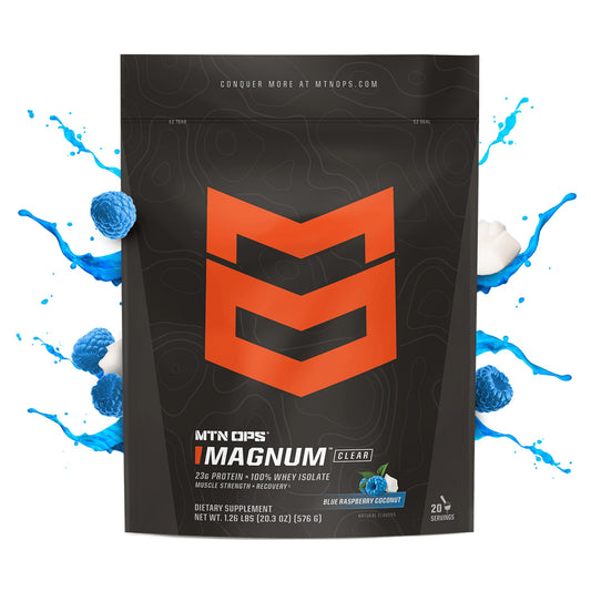 Magnum Clear Whey shake in glass highlights blue raspberry coconut flavor.