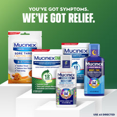 Mucinex DM 12Hr bottle beside tissues for cold season relief.
