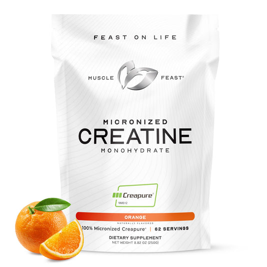 Muscle Feast Creapure orange powder in a jar for pure creatine support
