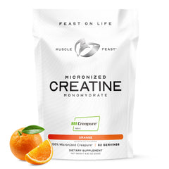 Muscle Feast Creapure orange powder in a jar for pure creatine support