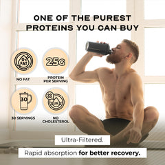Muscle Feast grass-fed whey isolate vanilla shake glass shows creamy, low-carb nutrition