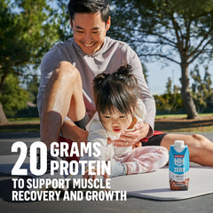 Muscle Milk Zero Chocolate glass with foam, smooth shake for breakfast.