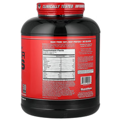 MuscleMeds Carnivor Mass strawberry shake in glass, ideal for post-workout refuel.