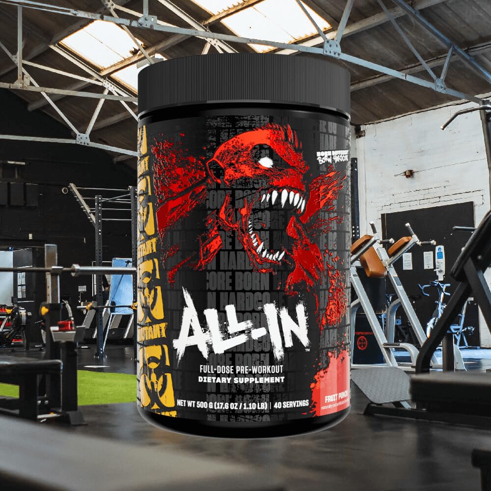 Mutant All-In Fruit Punch scoop in water ready to mix for sustained energy