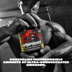 Mutant Madness scoop beside tub measures servings for precise dosing