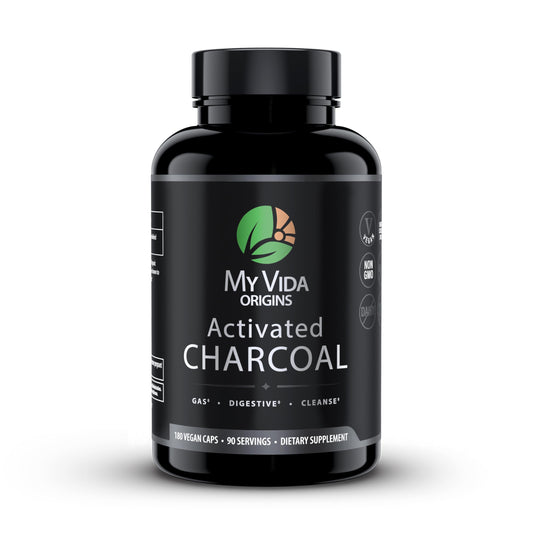 My Vida Origins bottle with activated charcoal capsules promotes gentle detox support.