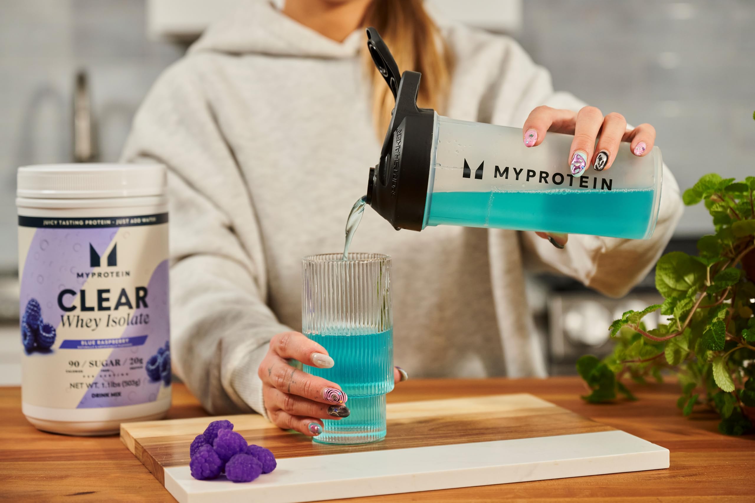Myprotein Clear Whey Isolate blue raspberry scoop measuring daily protein intake