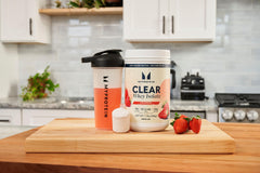 Myprotein Clear Whey Isolate Strawberry glass shows thirst-quenching protein during training
