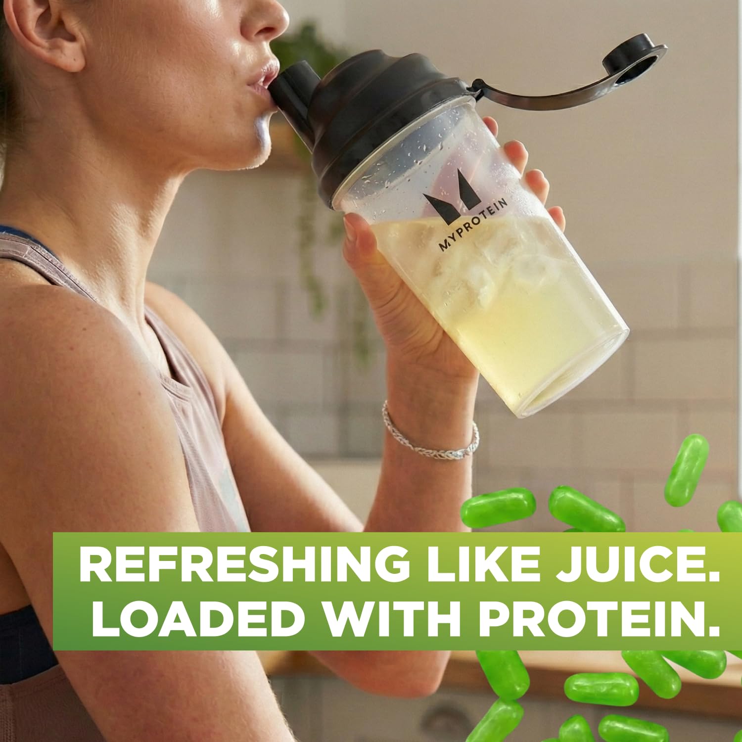 Myprotein Clear Whey Isolate scoop pouring powder into water.