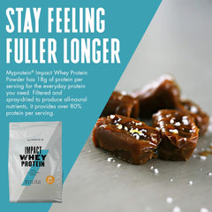 Pouring salted caramel whey into a glass to fuel workouts.