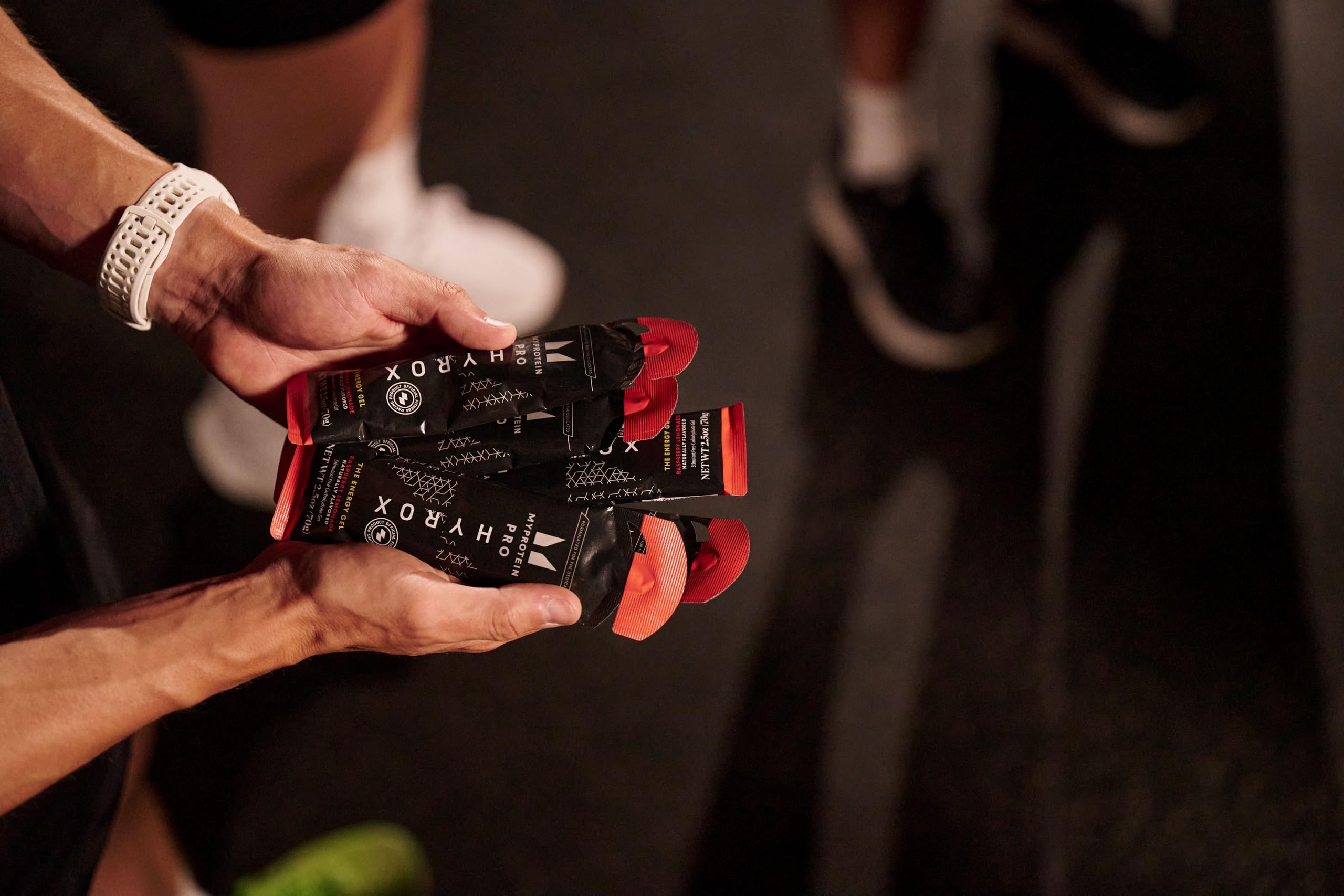Athlete using the gel during training for quick energy and focus