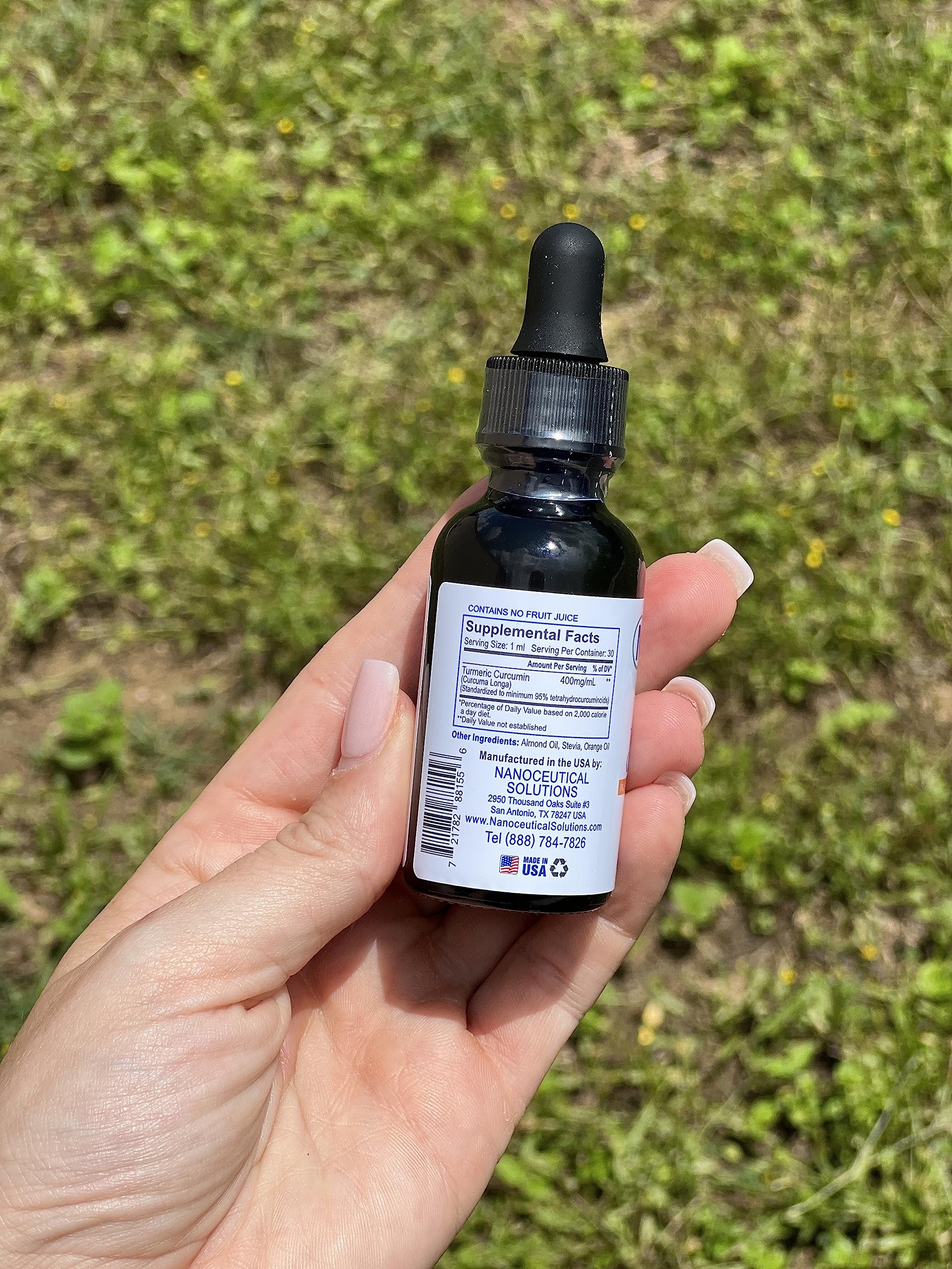 Drops midair representing fast dissolution and rapid absorption of Nano Turmeric Curcumin.
