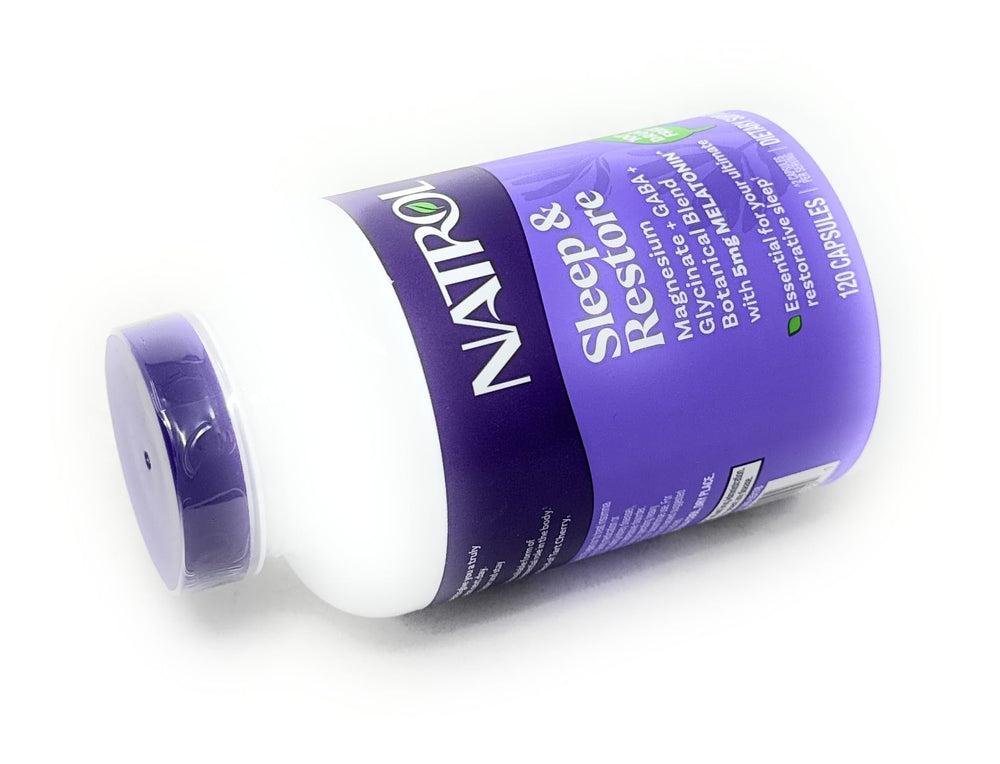 Lemon balm and chamomile display alongside Natrol Sleep & Restore bottle