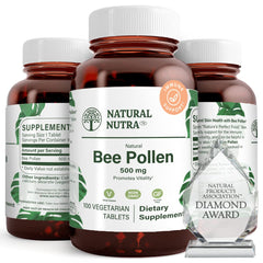 Natural Nutra Bee Pollen 500 mg bottle close-up highlights nutrient-dense tablets for vitality.