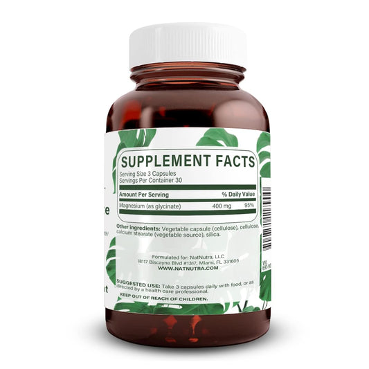 Close-up of Natural Nutra magnesium glycinate capsules ready for daily use