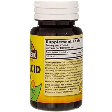 Nature's Blend Folic Acid bottle beside a glass of water for quick dosing.