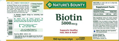 Nature's Bounty Biotin 5000mcg softgel close-up shows rapid-release capsule.