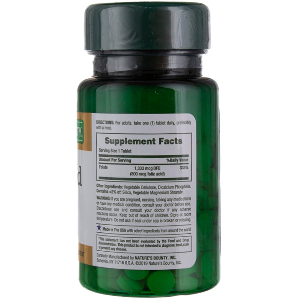Closeup of Nature's Bounty Folic Acid 800 mcg tablets highlighting maximum strength formulation.