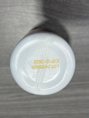 Person taking a Nature’s NutriWave VigorBoost gummy.