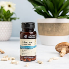Capsules close-up from Nature's Sunshine Colostrum with Immune Factors for easy dosing