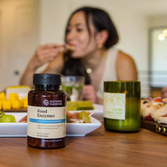 Nature's Sunshine Food Enzymes with a glass of water for daily use.