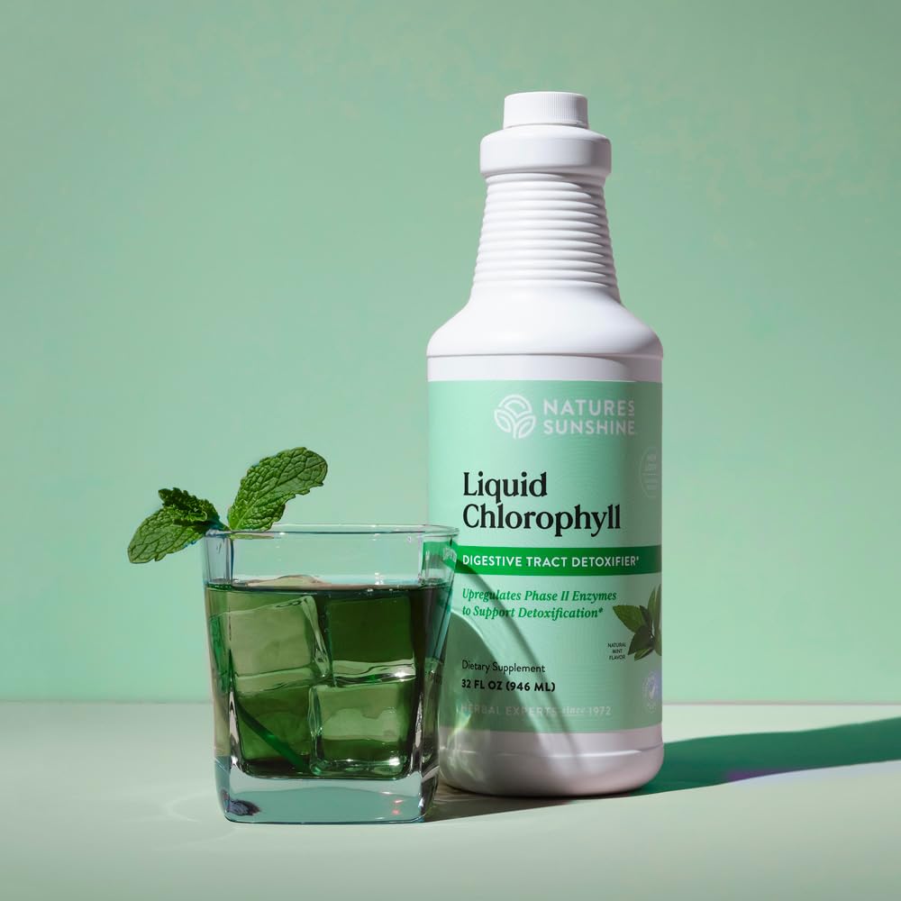 Nature's Sunshine chlorophyll drops pour into glass for daily detox.