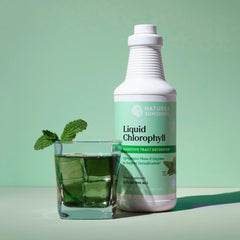 Nature's Sunshine chlorophyll drops pour into glass for daily detox.