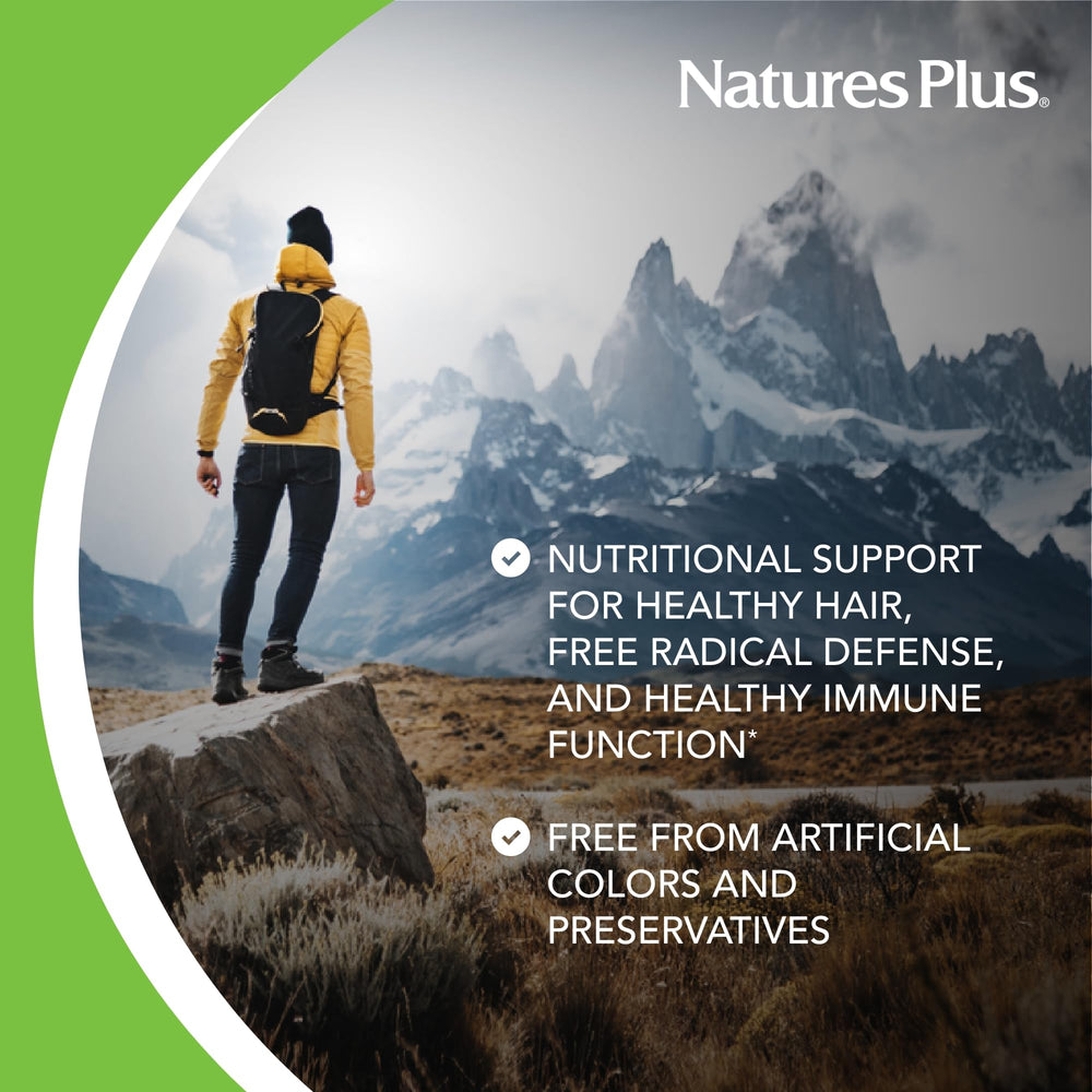 NaturesPlus AgeLoss Hair Support capsules closeup emphasizing extended release design.