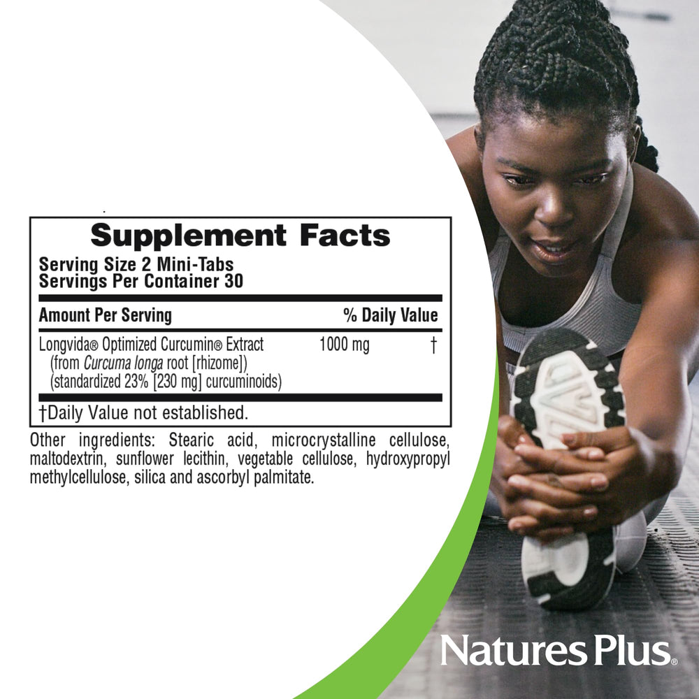 NaturesPlus PRO Longvida Curcumin capsules pour into a glass.