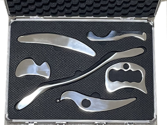 NCCYOOT six-piece gua sha set in polished steel for smooth, controlled massage.