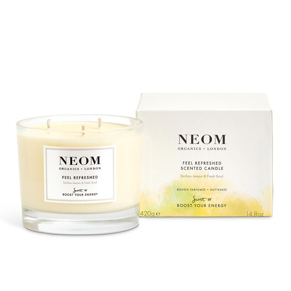 Neom Feel Refreshed candle with 3-wick lemon basil energizes space