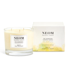Neom Feel Refreshed candle with 3-wick lemon basil energizes space