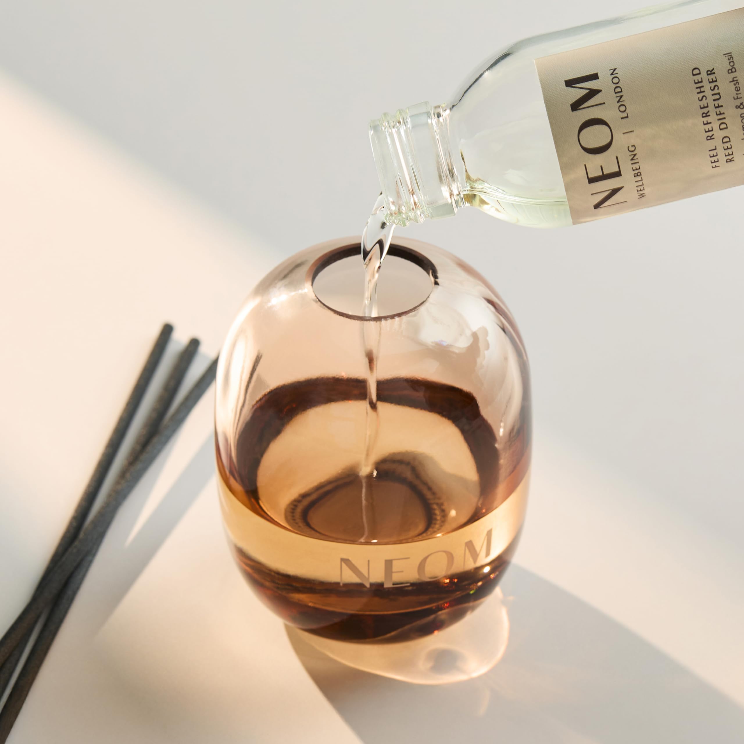 NEOM Feel Refreshed glass vessel highlighting refill option