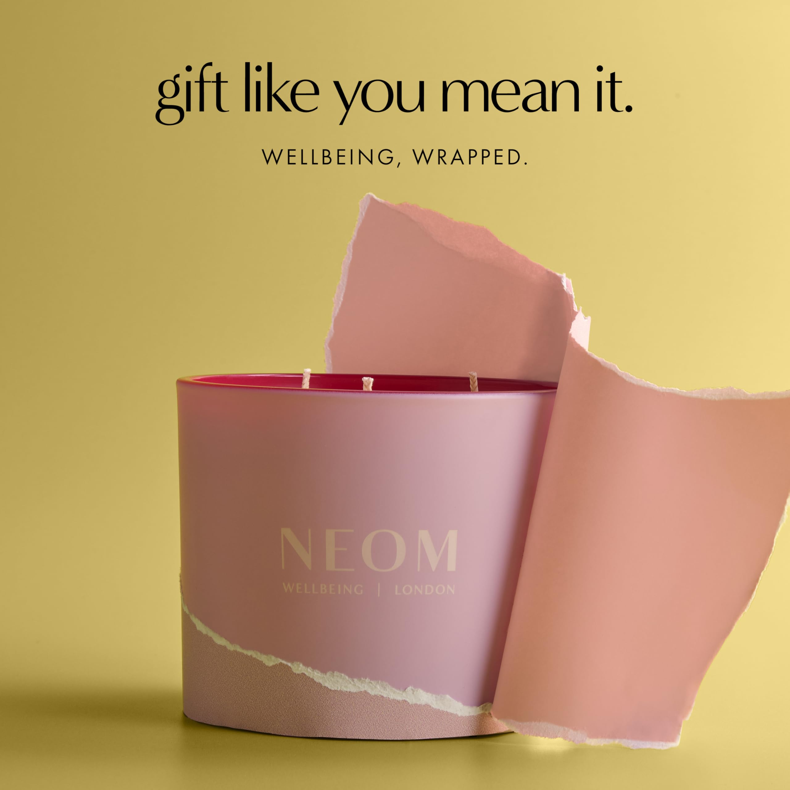 NEOM It's All Rosy Candle rose scent close-up highlights fragrance.