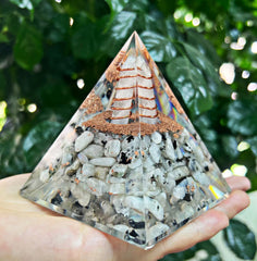 NewMainOne orgonite pyramid balance energy in desk or altar space.