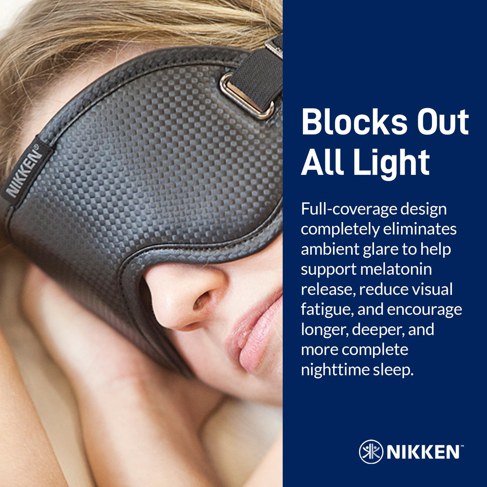 Nikken Kenko PowerSleep Mask worn over eyes during travel or meditation.