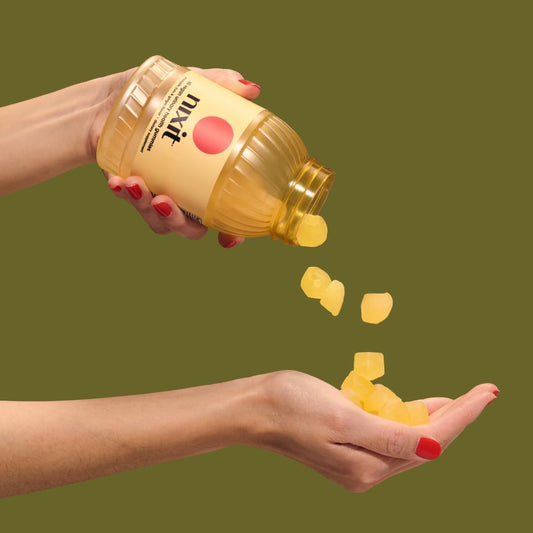 Nixit gummies pouring to emphasize ease of daily urinary tract care.