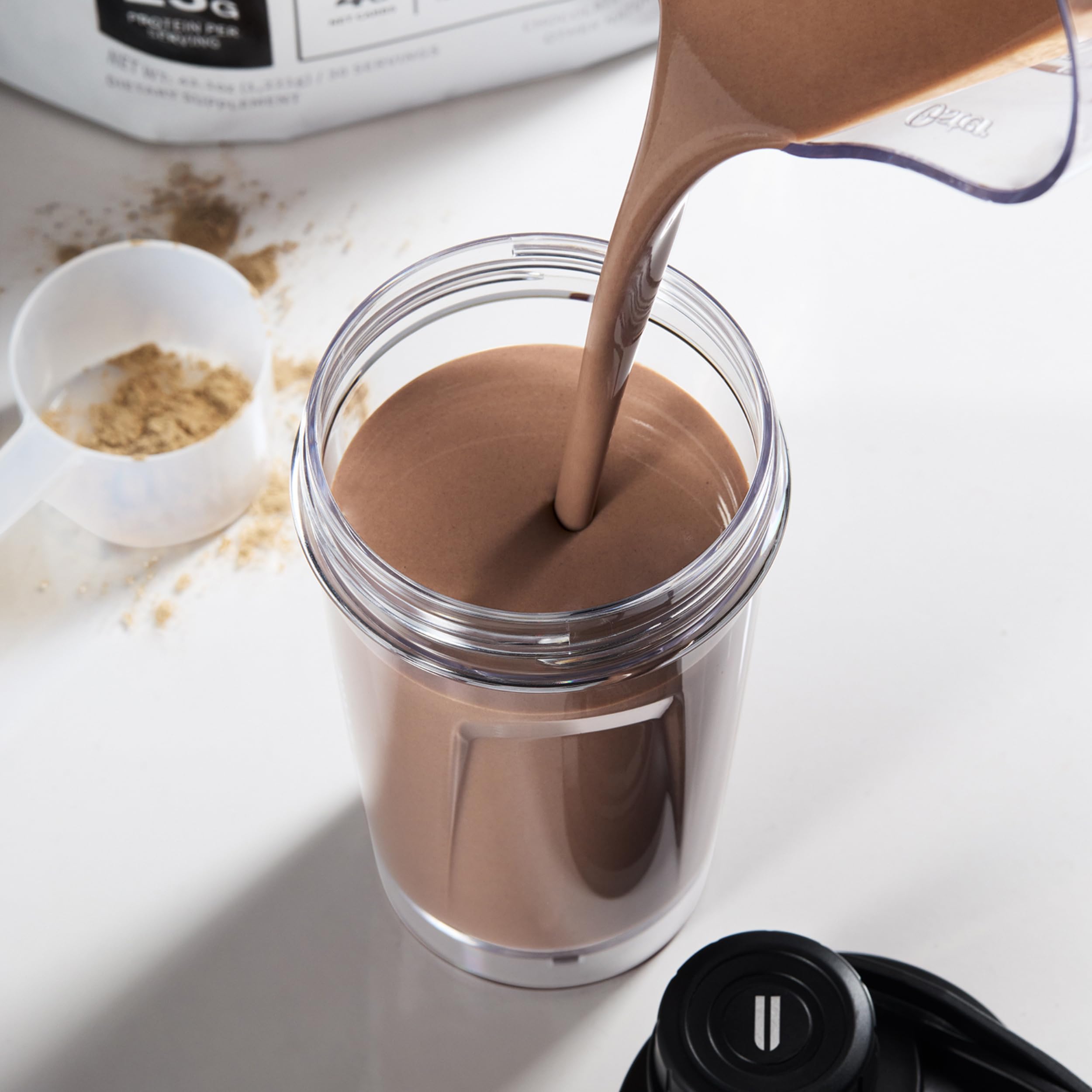 NOBULL Plant Protein pour action highlights quick mixability and chalk-free texture.